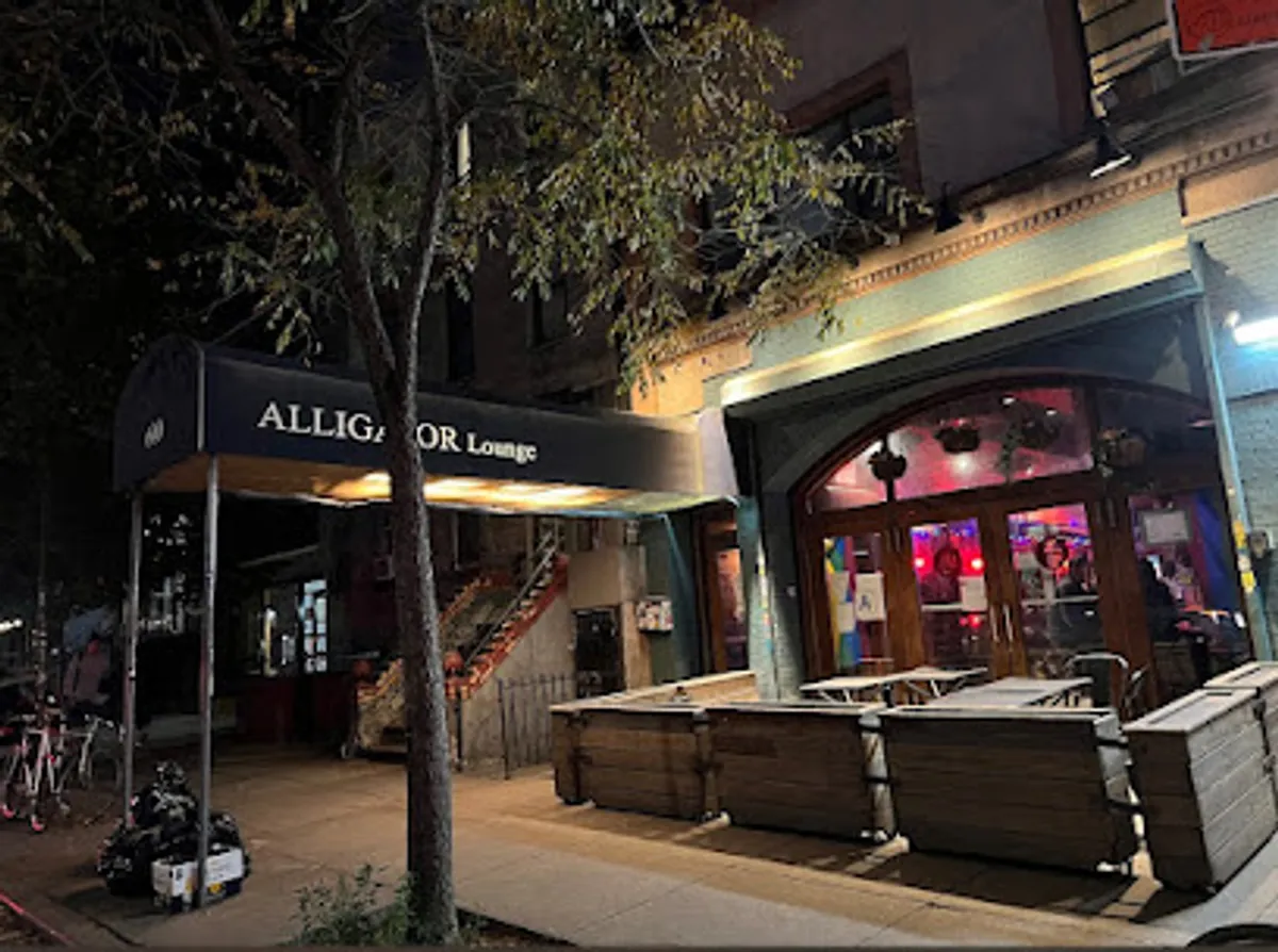 Interior view of Alligator Lounge with guests enjoying drinks and games