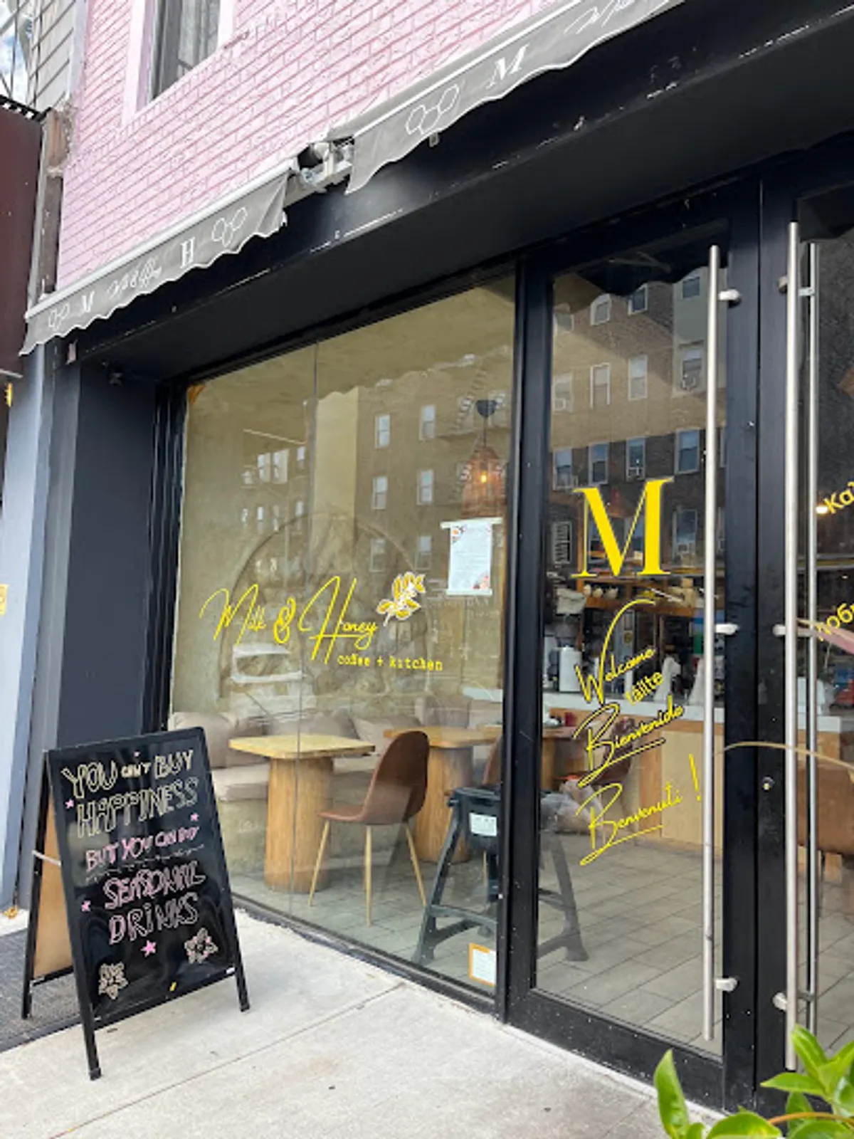 Interior view of Milk & Honey Cafe in Brooklyn with customers enjoying meals