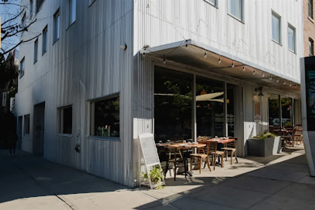 Interior view of Bacàn Italian restaurant in Brooklyn showing tables and bar