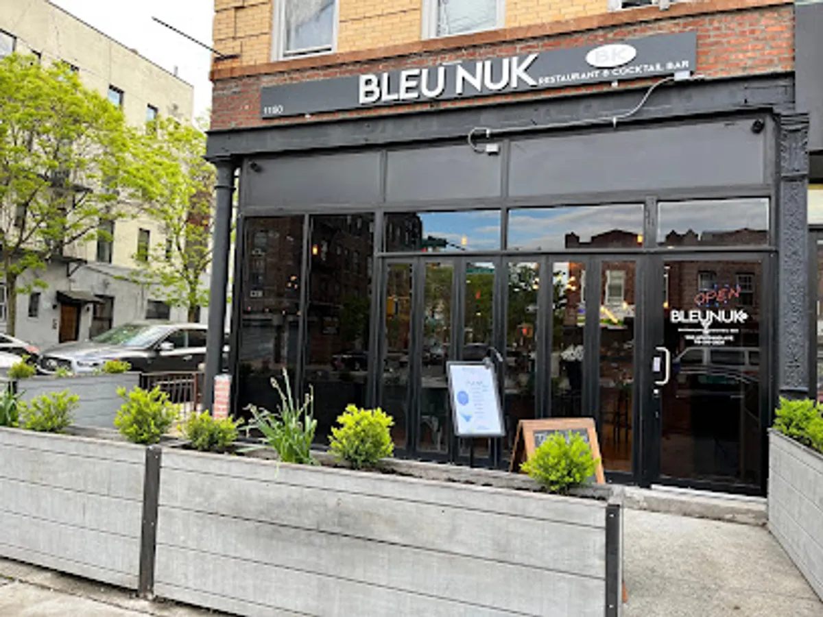Interior of Bleu Nuk Bk showing diners and Caribbean-inspired decor